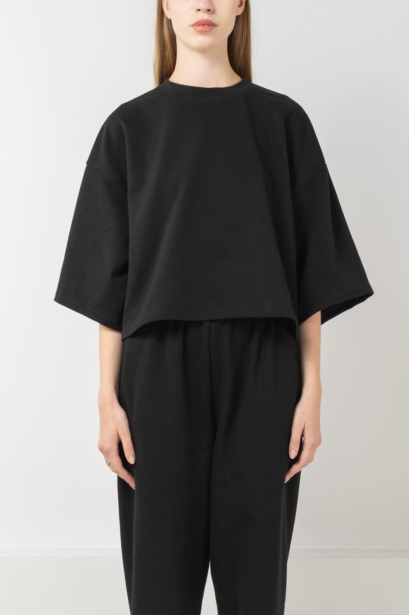 Loose fit black french terry T-shirt with drop shoulders.