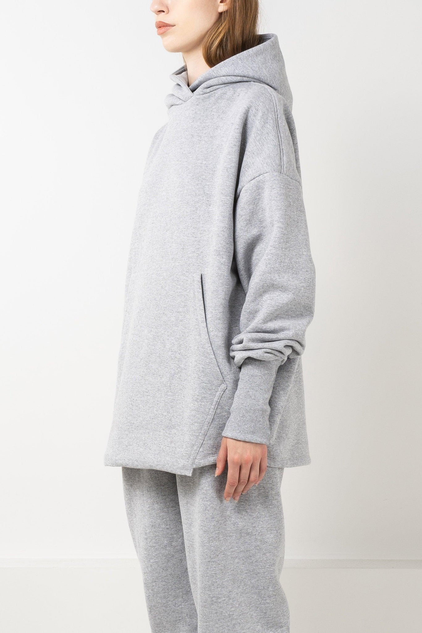 Oversized grey fleece hoodie with drop shoulders and double layered hood.