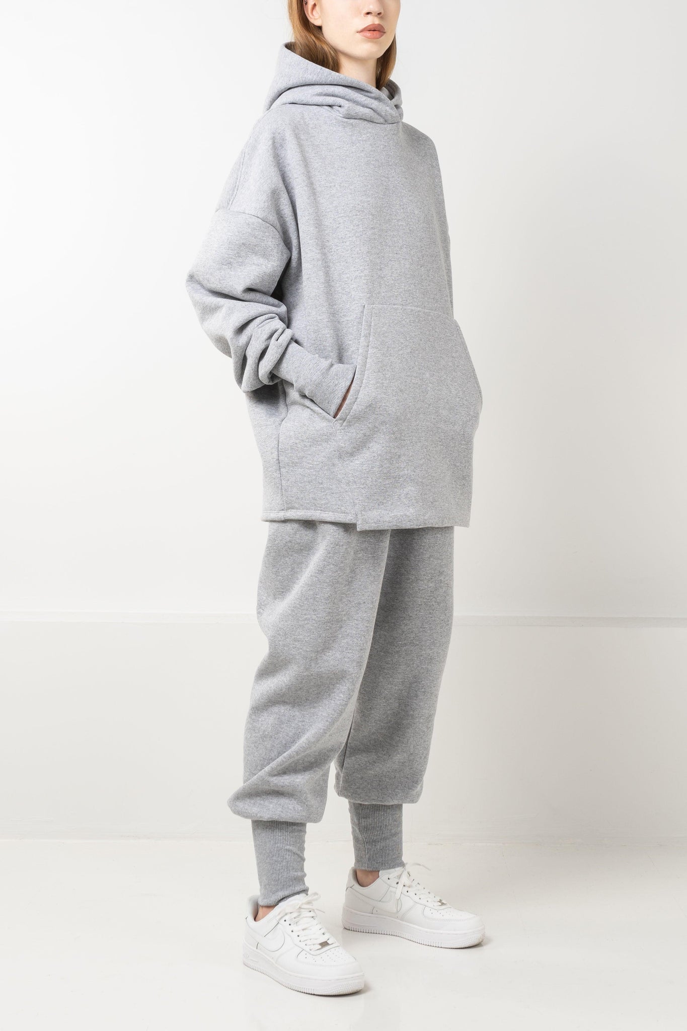 Oversized grey fleece hoodie with drop shoulders and double layered hood.