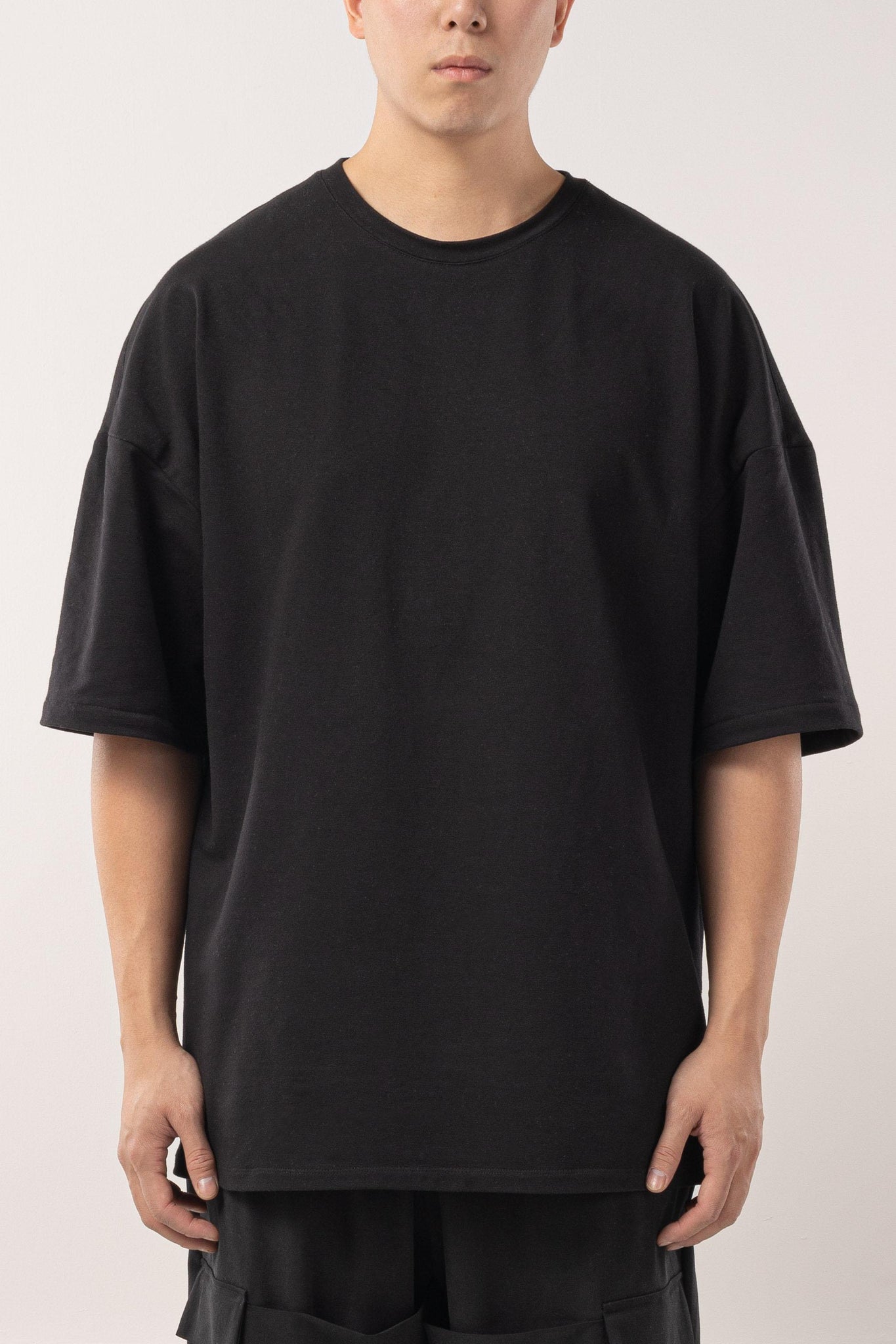 Loose fit black french terry T-shirt with drop shoulders.