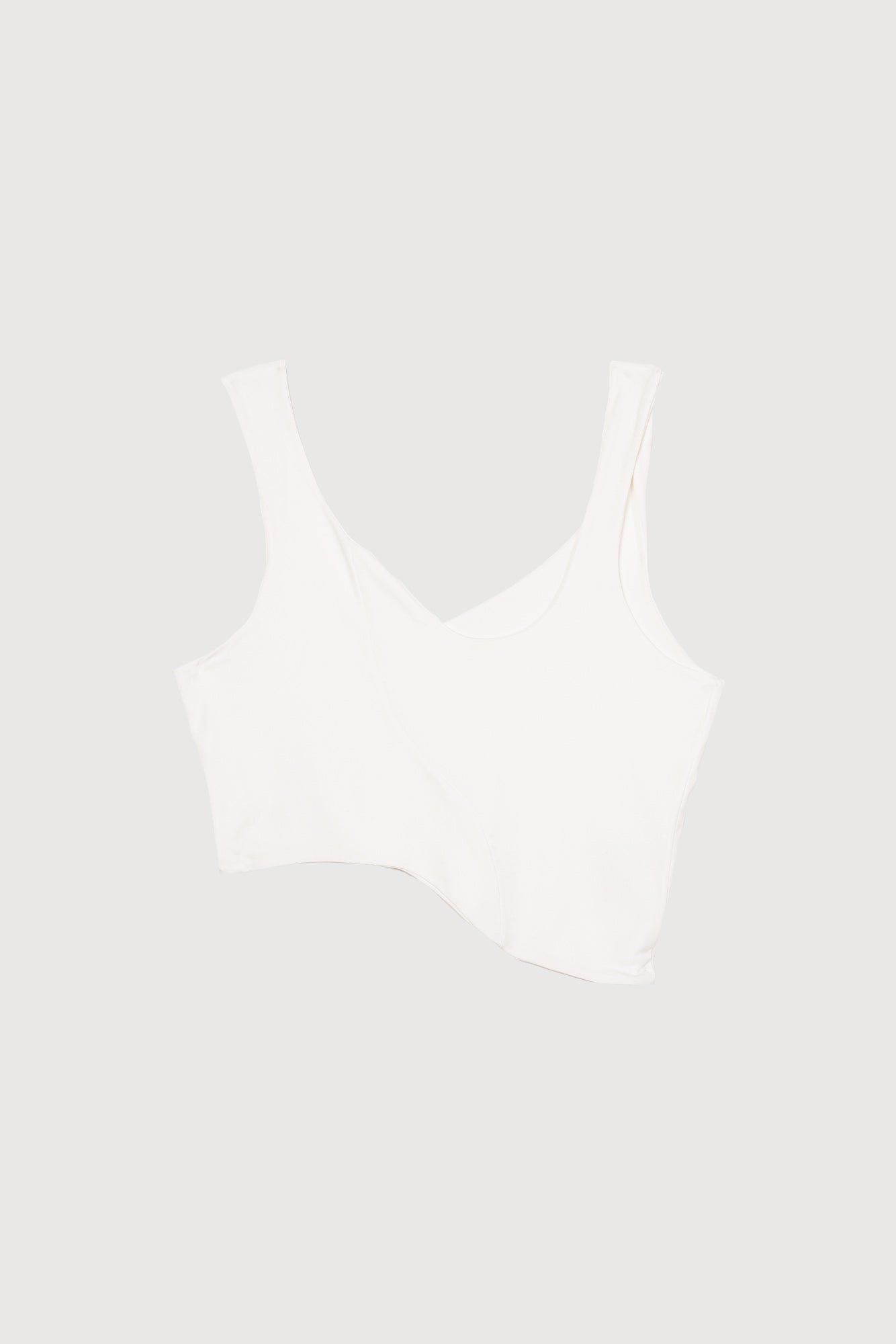 Fitted white tank top made with soft and stretchy knit. 